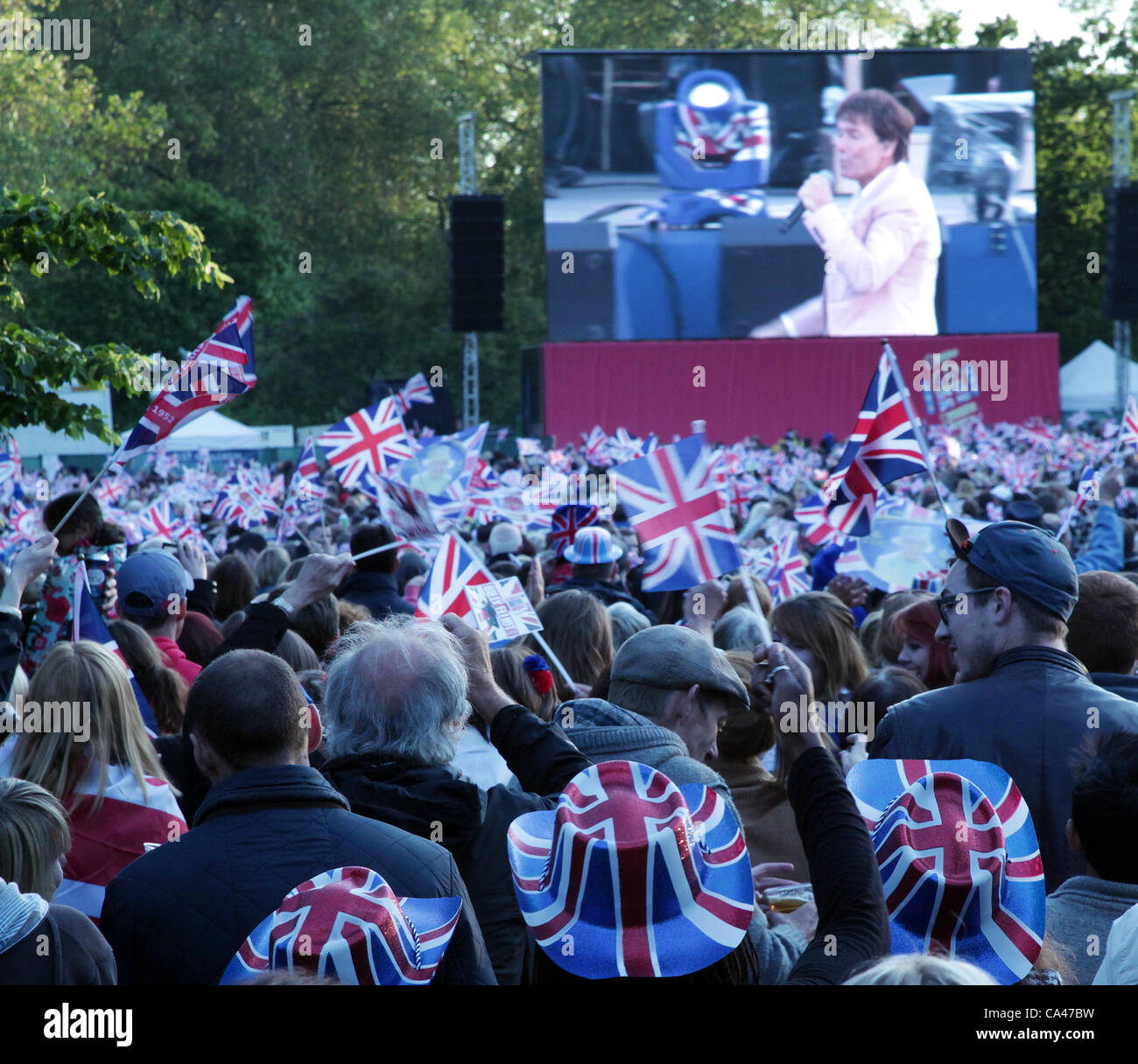 London, UK. June 4, 2012. Fans in London, enjoying Sir Cliff Richard on the big screen in St. james Park Concert to celebrate The Queen's Diamond Jubilee.  . Stock Photo