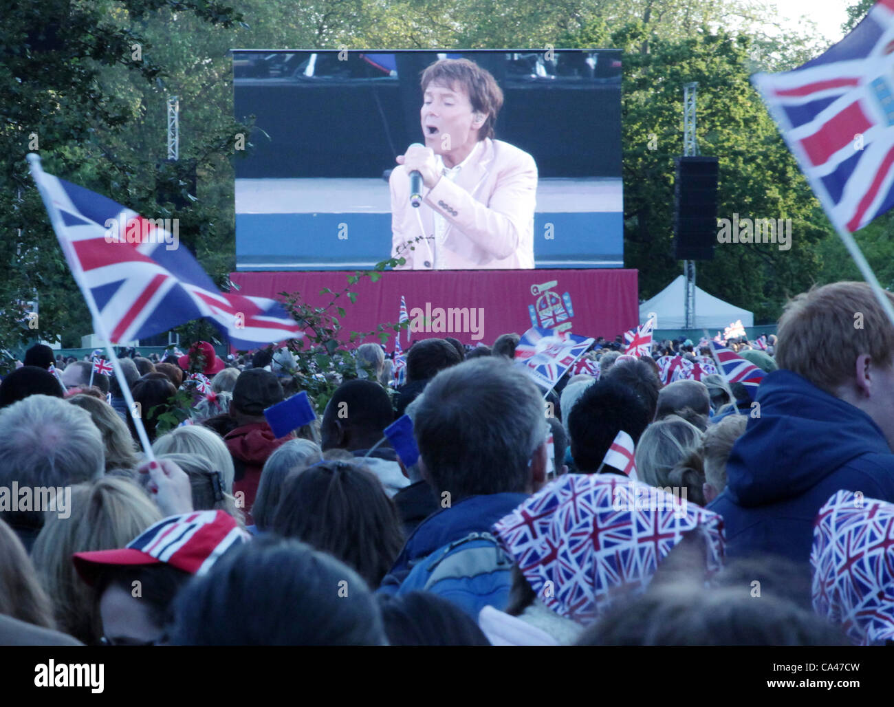 London, UK. June 4, 2012. Fans in London, enjoying Sir Cliff Richard on the big screen in St. James's Park Concert to celebrate The Queen's Diamond Jubilee.  . Stock Photo