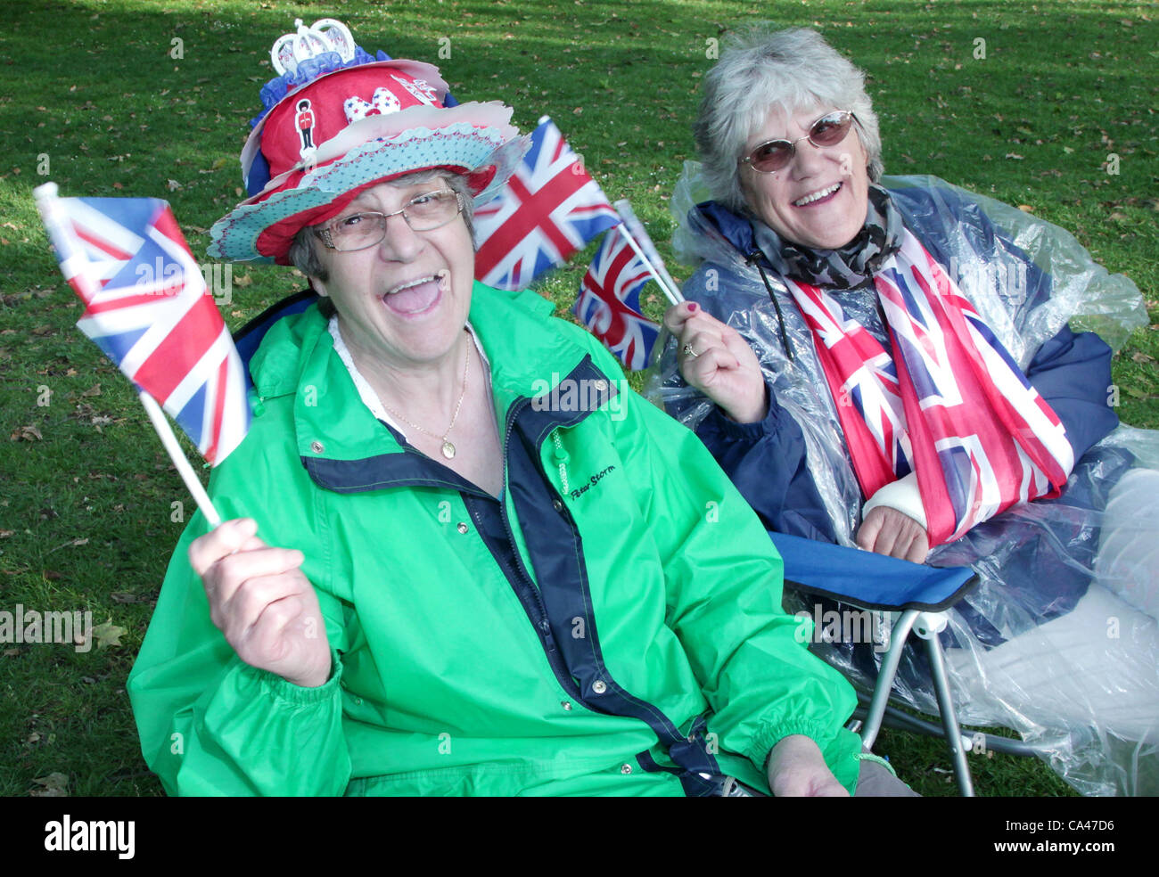 London, UK. June 4, 2012. Gill Watkins from Suffolk England and Liz Lyddon from Hampshire at St James's Park enjoying the music at the Concert to celebrate The Queen's Diamond Jubilee. 'They are looking forward to hearing Sir Cliff Richard sing'. Stock Photo