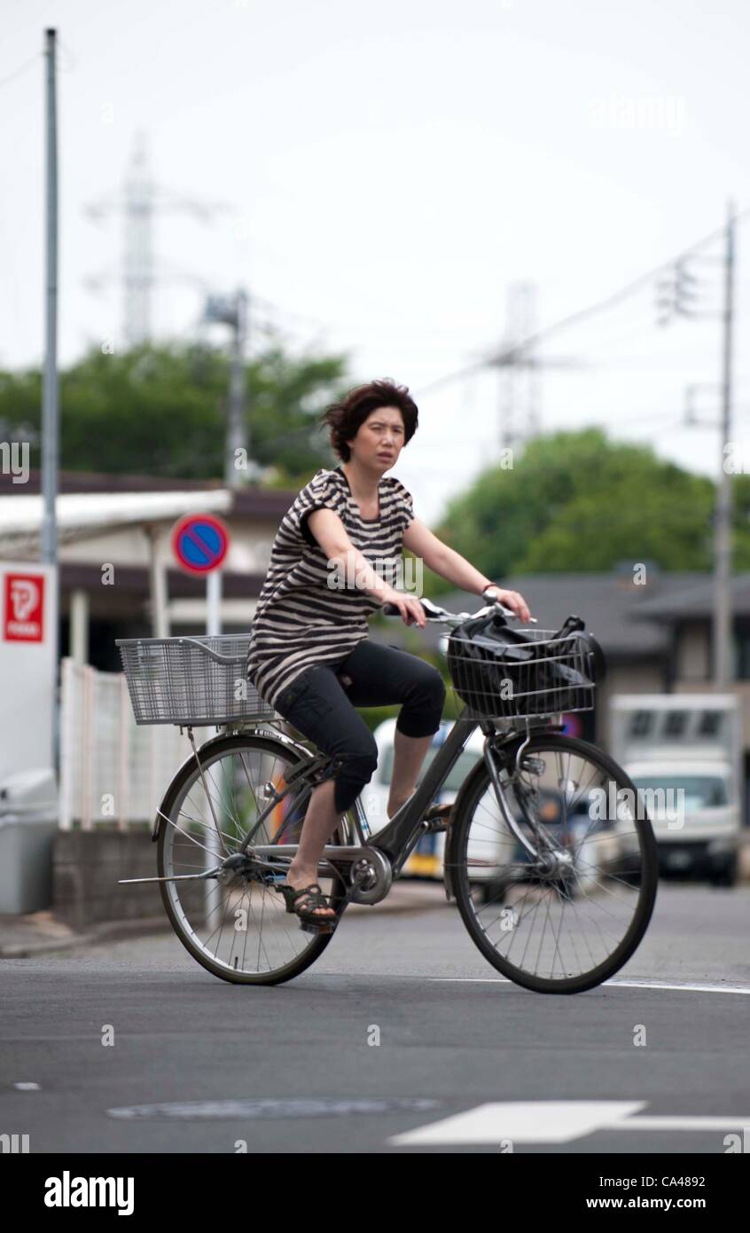 June 5, 2012 Tokyo, Japan A Japanese woman is seen riding a bicycle