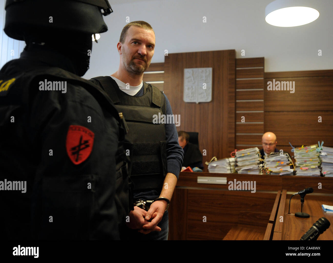 Controversial entrepreneur Tomas Pitr, center, wearing a bulletproof