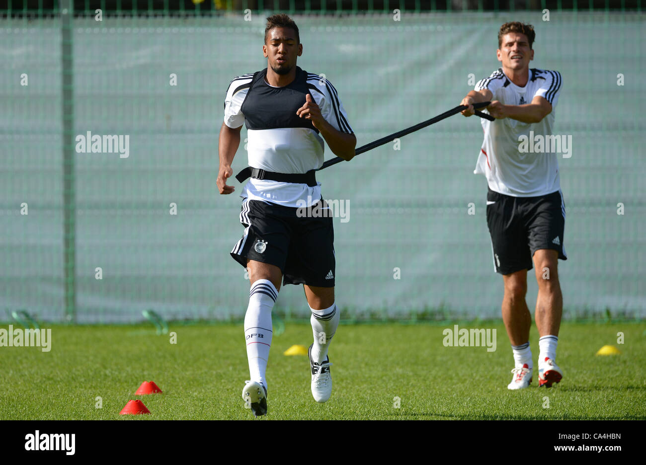 06.06.2012. Gdansk, Poland.  Germany's Jerome Boateng (L) and Mario Gomez during a training session of the German national soccer team on the training pitch next to hotel Dwor Oliwski in Gdansk, Poland. The UEFA EURO 2012 will take place from 08 June to 01 July 2012 and is co hosted by Poland and Uk Stock Photo