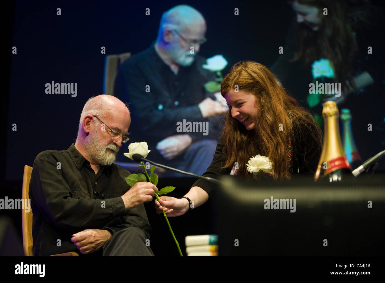 Terry Pratchett presented with a white rose after speaking about his life and work at The Telegraph Hay Festival 2012, Hay-on-Wye, Powys, Wales, UK Stock Photo