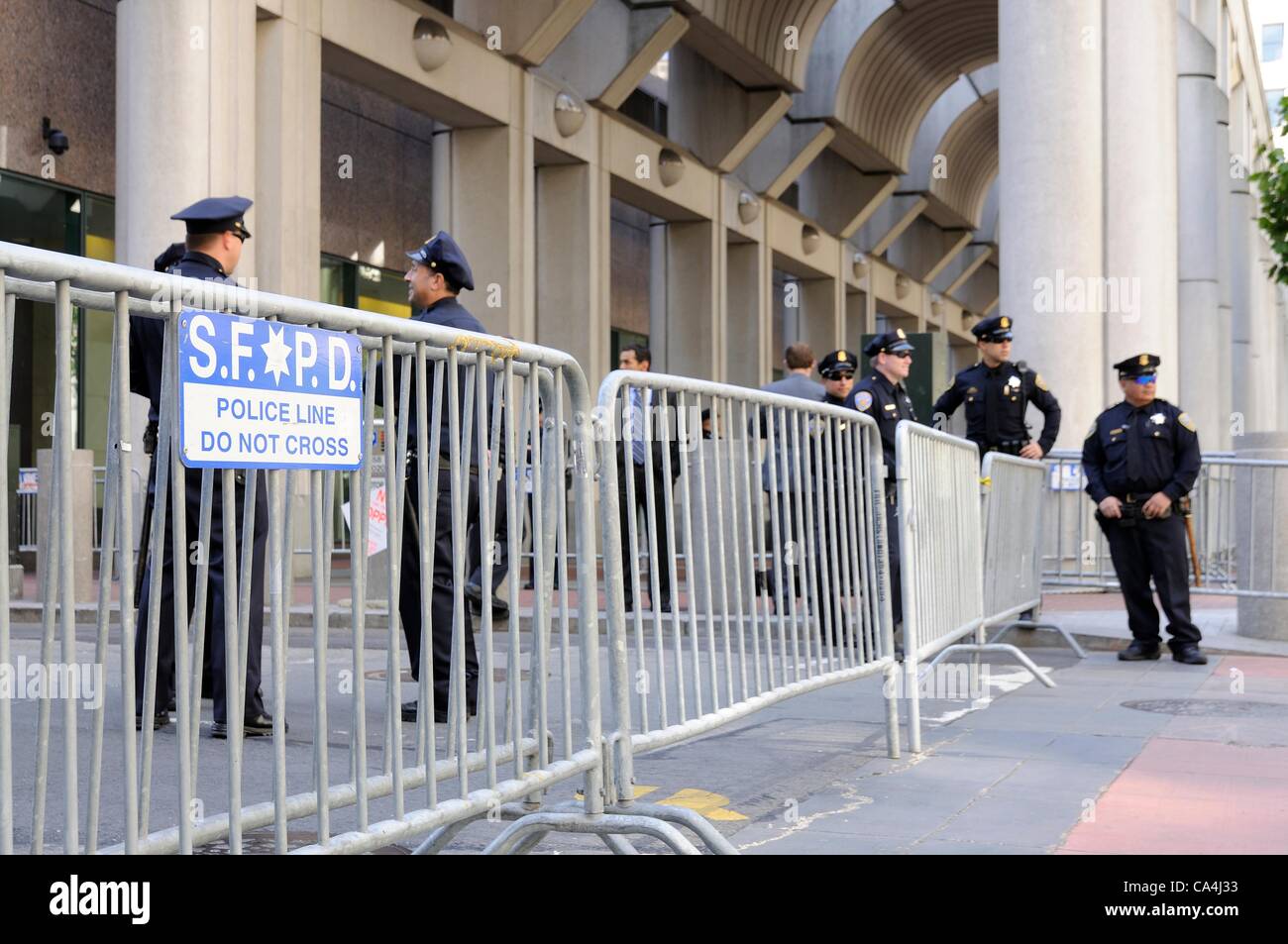 San Francisco, California, USA - June 06, 2012: San Francisco Police Officers, cordon off Spear Street ahead of President Obama arriving for a financial meeting he has planned toward funding for his election campaign. Stock Photo