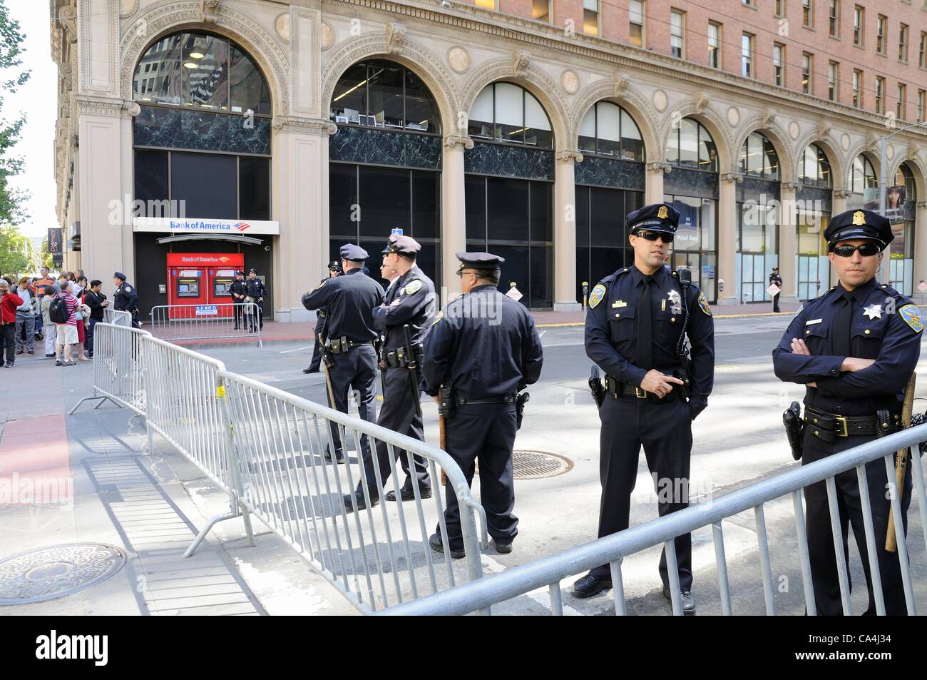San Francisco, California, USA - June 06, 2012: Armed San Francisco Police Officers, cordon off Spear Street ahead of President Obama arriving for a financial meeting he has planned toward funding for his election campaign. Stock Photo