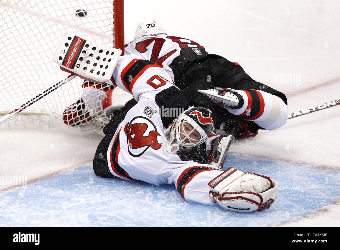06.06.2012. Staples Center, Los Angeles, California. New Jersey Devils goaltender #30 Martin Brodeur (CAN) sprawls for a save as teammate defensemen #28 Anton Volchenkov (USSR) knocks off the goal during the New Jersey Devils game versus the Los Angeles Kings in game 4 of the Stanley Cup Final at Stock Photo