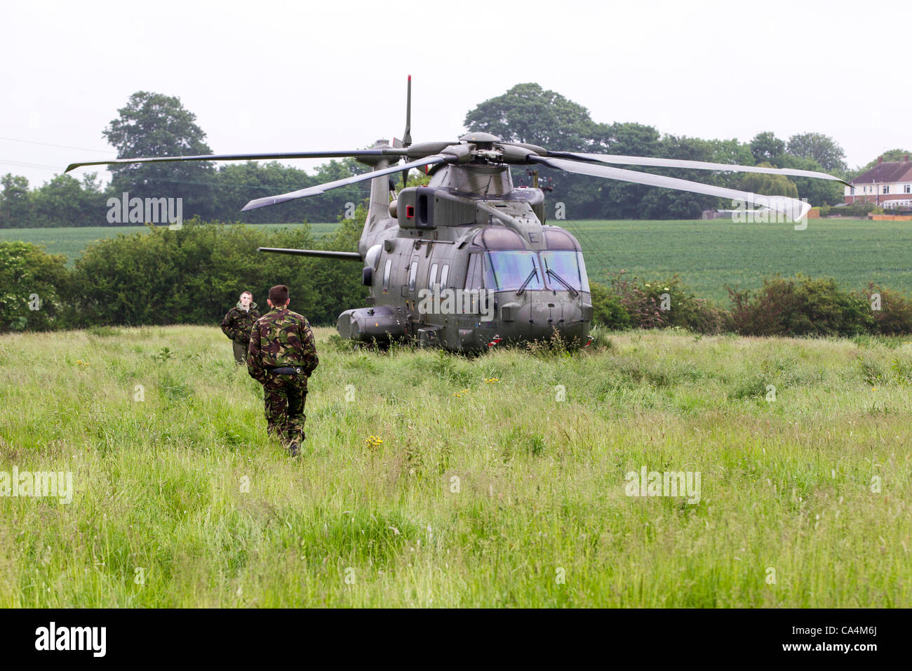 2012-06-07. Stanwick, Northamptonshire, UK. RAF Merlin mk3 helicopter grounded at a field in Stanwick on 06-06-2012 due to a loose panel near the rear rotor. After the repairs they hope to return to RAF Benson later this morning. Stock Photo