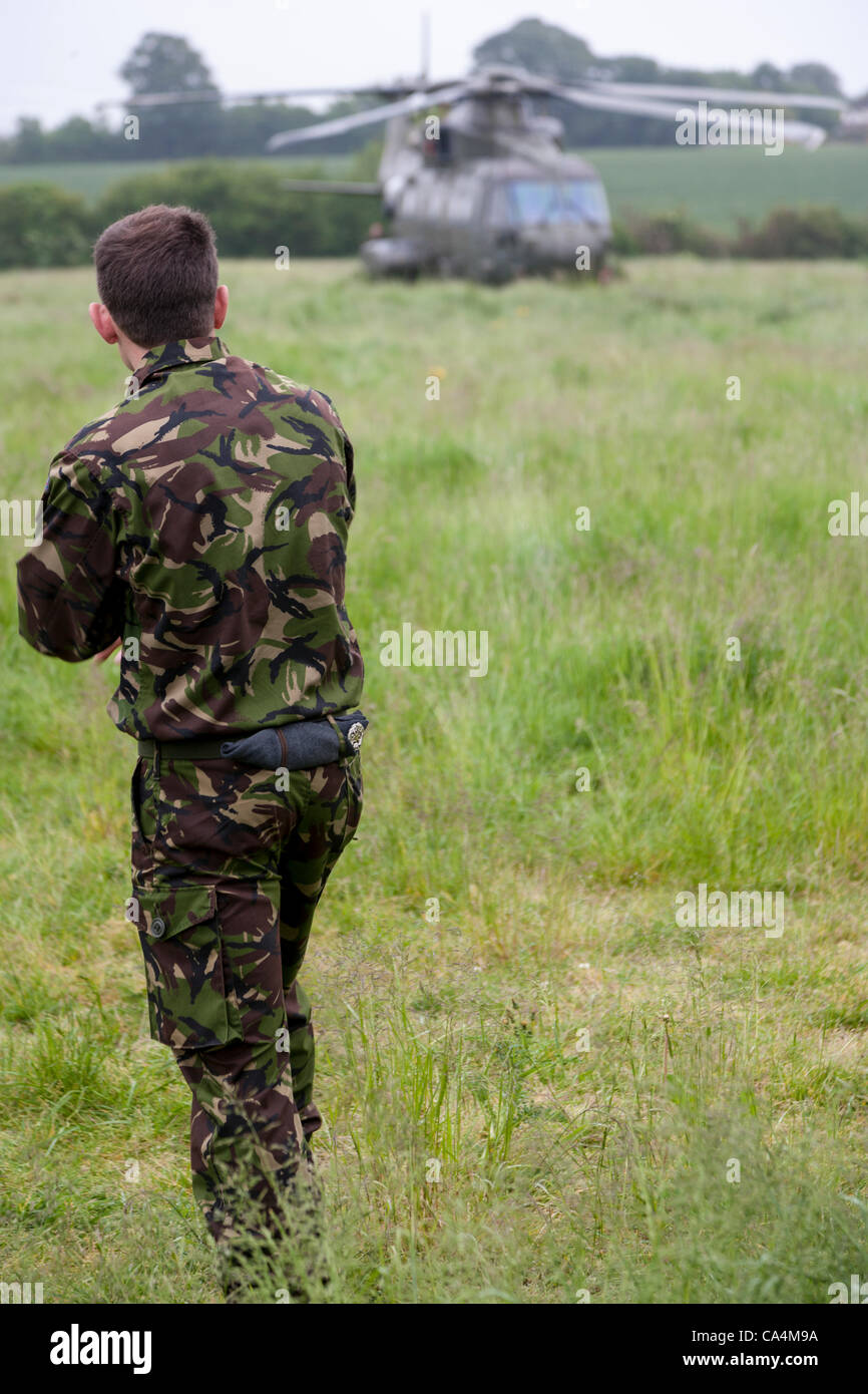 2012-06-07. Stanwick, Northamptonshire, UK. RAF Merlin mk3 helicopter grounded at a field in Stanwick on 06-06-2012 due to a loose panel near the rear rotor. After the repairs they hope to return to RAF Benson later this morning. Stock Photo