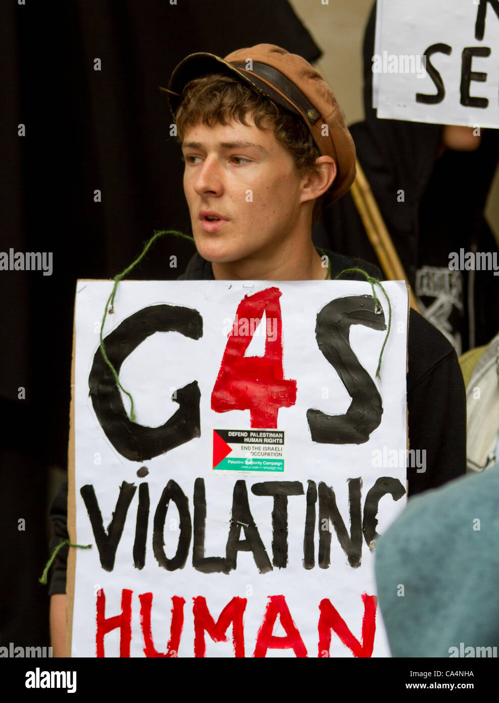 London, UK. 07th June 2012. Activists from different movements gathered outside London Stock Exchange, Paternoster Square, London with signs where the private security company 'G4S' held the Annual General Meeting. Protesters accusing G4S of human rights abuse throughout the world. Stock Photo