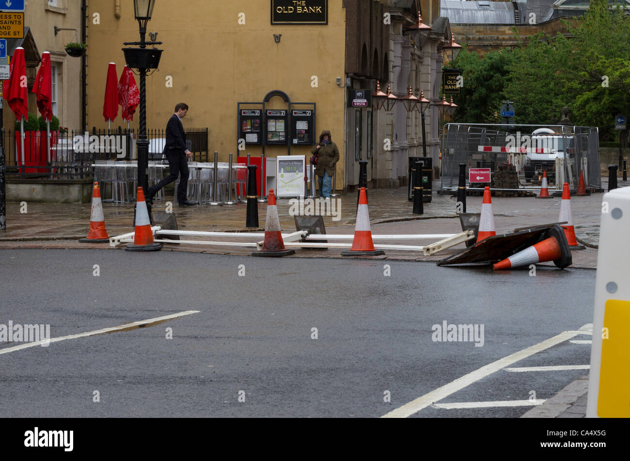 Northampton, UK. Friday 8th June 2012. Cones and debris blow around the streets as the heavy rain and strong winds hit Northampton. This weather is unseasonal for June. Stock Photo
