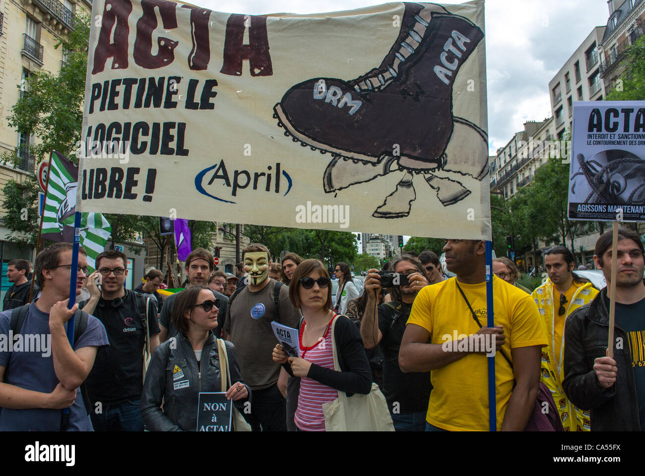 Activists from an Anti- ACTA Internet Accords Law, who oppose communications and censorship of internet networks, Holding Banners and signs,  at a Demonstration in Paris, France, protest free trade, young people protesting Stock Photo