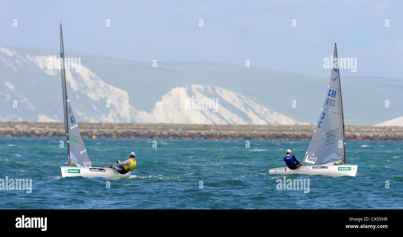 Eyeing up the opposition Giles Scott keeps and eye on Ben Ainslie.  Sail for Gold medal races at Portland in Dorset, U.K.  PICTURE BY: DORSET MEDIA SERVICE Stock Photo
