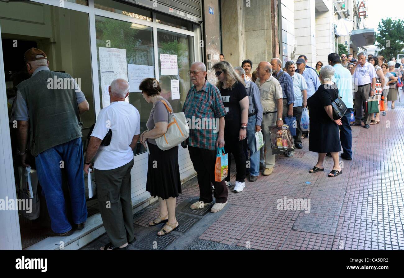 June 11 2012. Athens, Greece. People queue outside the National ...