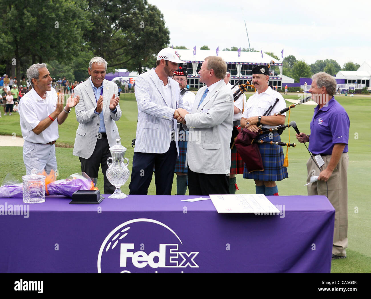 10.06.2012. Memphis, USA.  Dustin Johnson accepting championship trophy after winning the FedEx St. Jude Classic at TPC Southwind Memphis, TN. Stock Photo