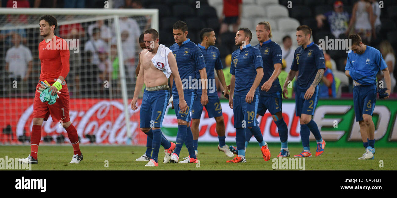 11.06.2012. Donetsk, Ukraine.  The French team led by goalkeeper Hugo Lloris (L) and Franck Ribery (2L) leave the pitch after the UEFA EURO 2012 group D soccer match France vs England at Donbass Arena in Donetsk, the Ukraine, 11 June 2012. Stock Photo