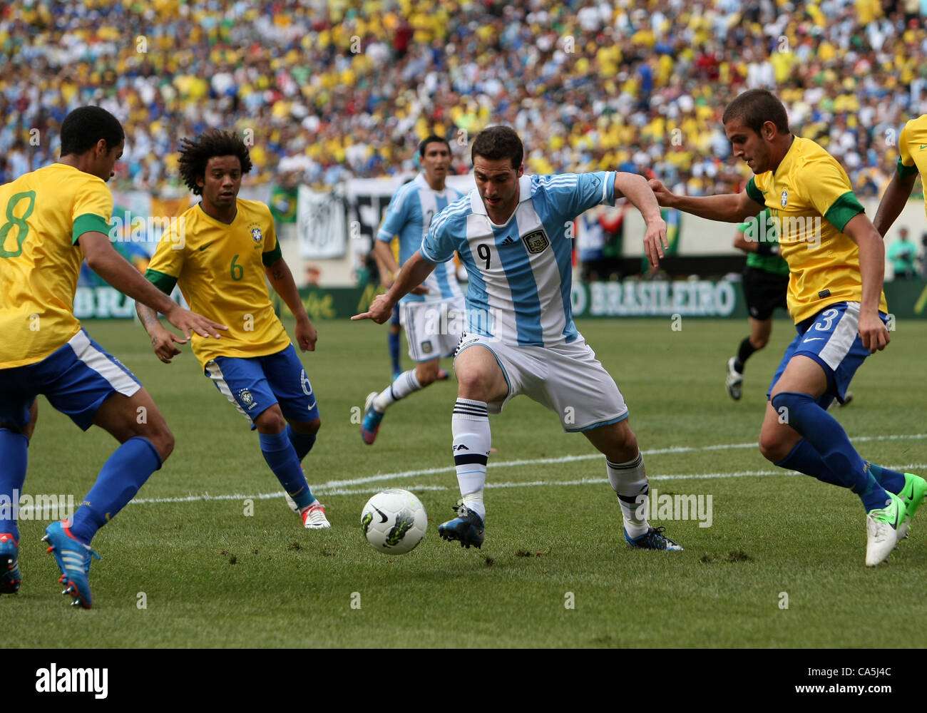 09.06.2012. New Jersey, USA. Gonzalo Higuain (9) of Argentina controls the ball around Romulo (8),Bruno Uvini (13) and Marcelo (6) of Brazil during an international friendly match at Metlife Stadium in East Rutherford,New Jersey. Argentina won 4-3. Stock Photo
