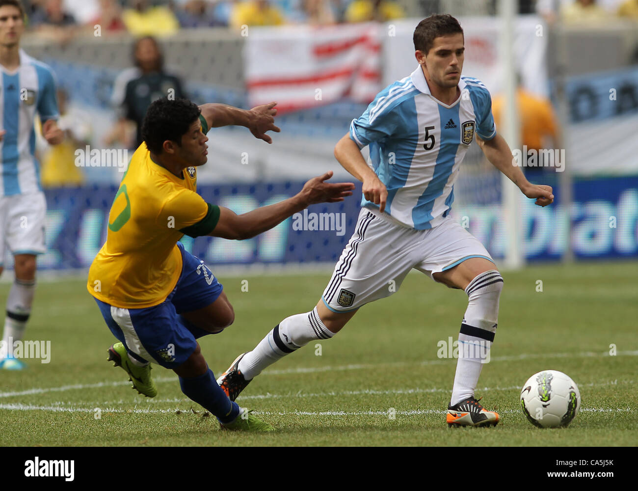 09.06.2012. New Jersey, USA. Fernando Gago (5) of Argentina gets away from Hulk (20) of Brazil during an international friendly match at Metlife Stadium in East Rutherford,New Jersey. Argentina won 4-3. Stock Photo