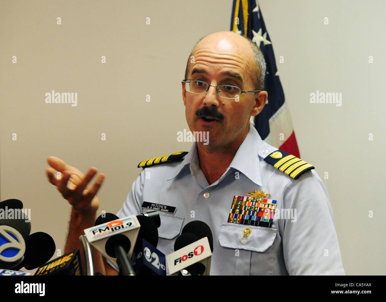 June 12, 2012 - Manhattan, New York, U.S. - Captain GREGORY HITCHEN, Deputy Commander of Coast Guard Sector New York, discusses the false distress call to the Coast Guard Monday, reporting a vessel explosion and sinking east of Sandy Hook, N.J., during a press conference at Coast Guard Battery Park  Stock Photo