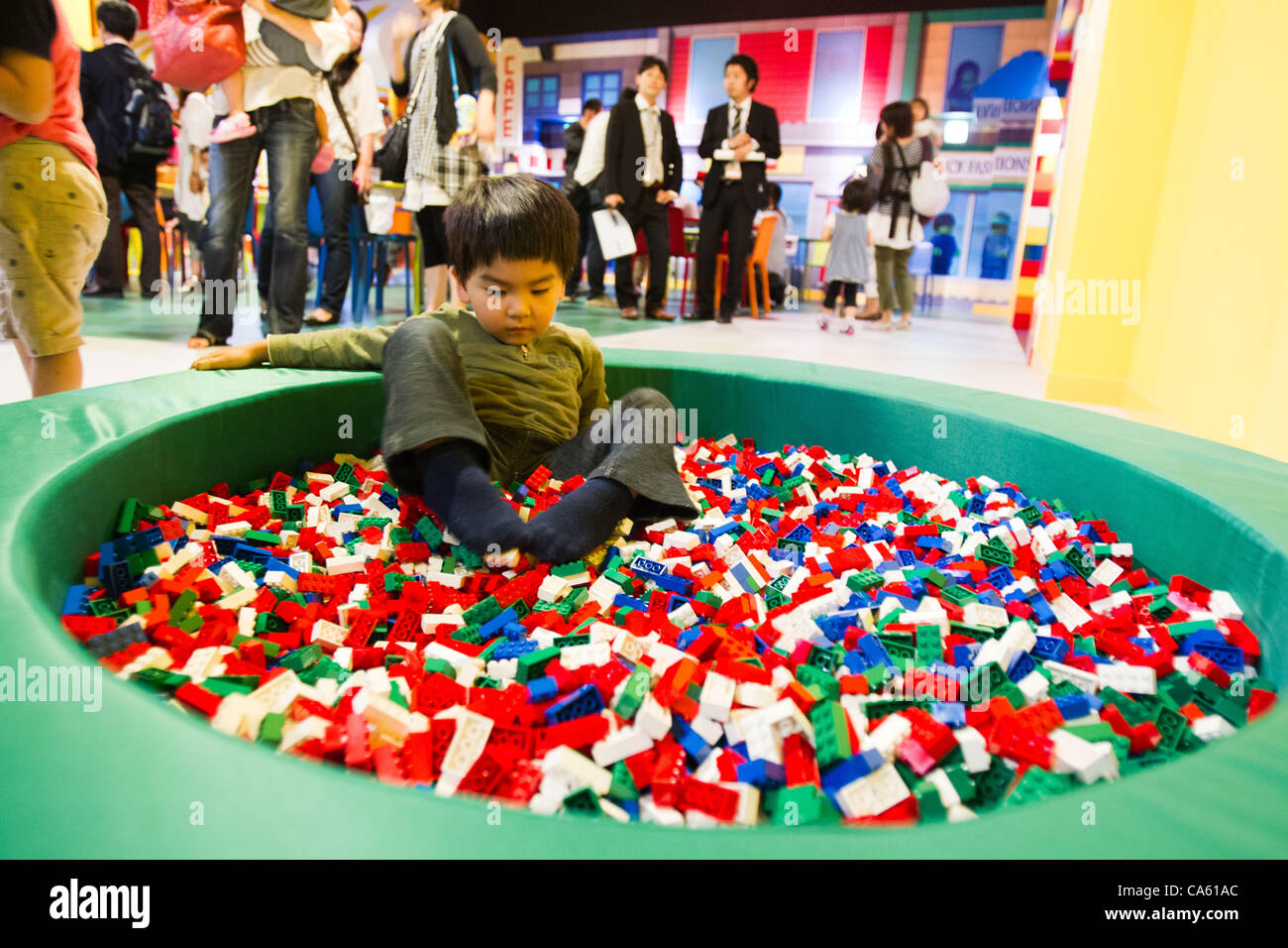 June 14, 2012, Tokyo, Japan - A young boy plays inside a pool of Lego bricks  during a press preview event at the LEGOLAND Discovery Center Tokyo. The  LEGOLAND Discovery Center contains