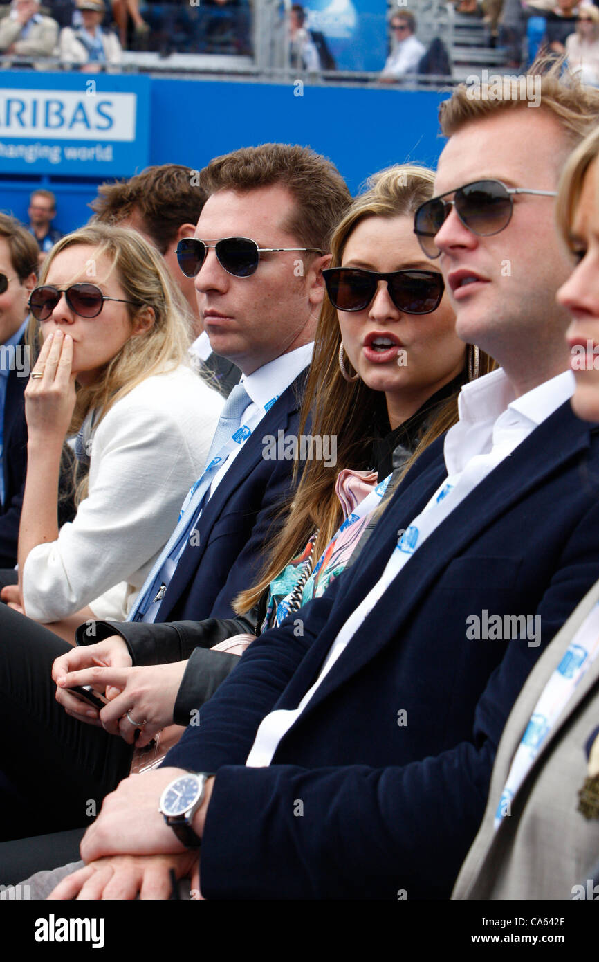 14.06.12 Queens Club, London, ENGLAND:  Holly Valance with boyfriend Nick Candy watching Jo-Wilfried Tsonga FRA and Ivan Dodig CRO on centre Court during day four of the Aegon Championships at Queens Club  on June 14, 2012 in London , England. Stock Photo