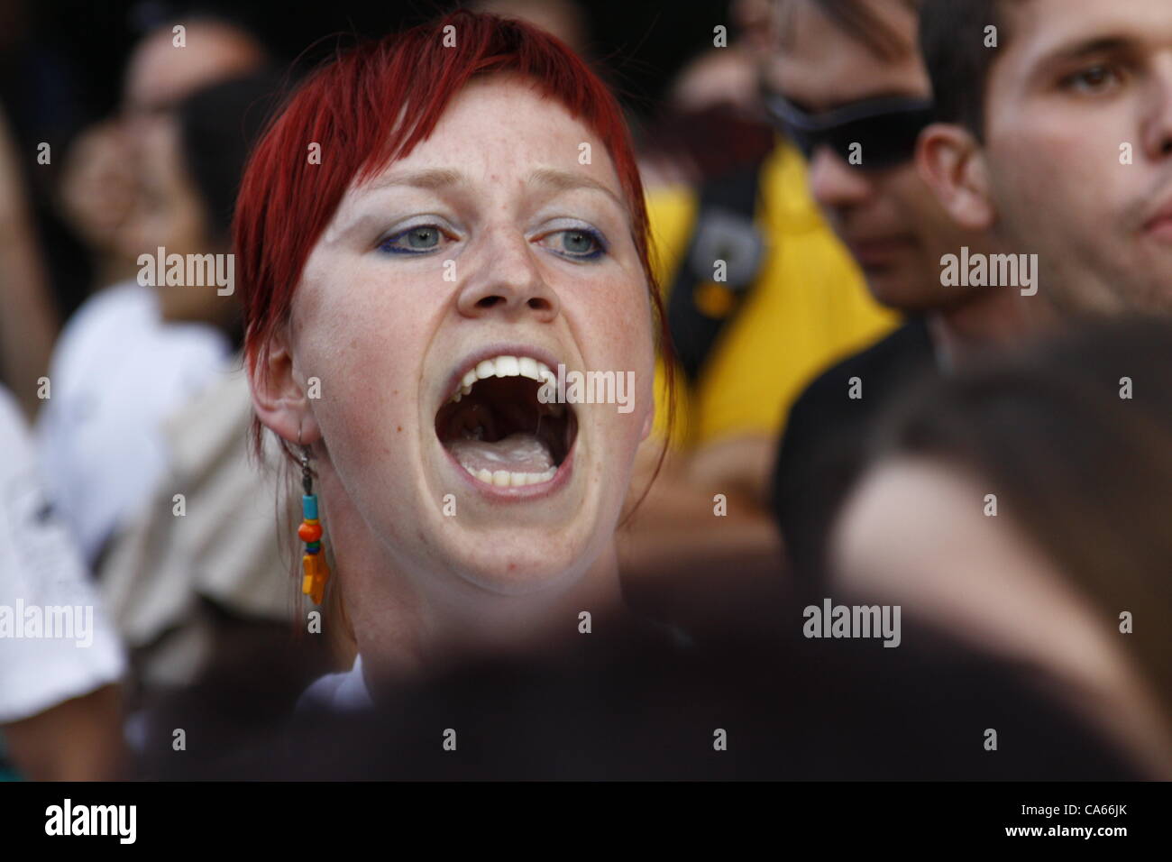Woman shouting during the anti-government rally near the center of Sofia. Demonstrators rally against a change in the Forrestry Act, introduced by the ruling GERB party that would make it easier to build ski tracks. Sofia, Bulgaria, 14/06/2012 Stock Photo