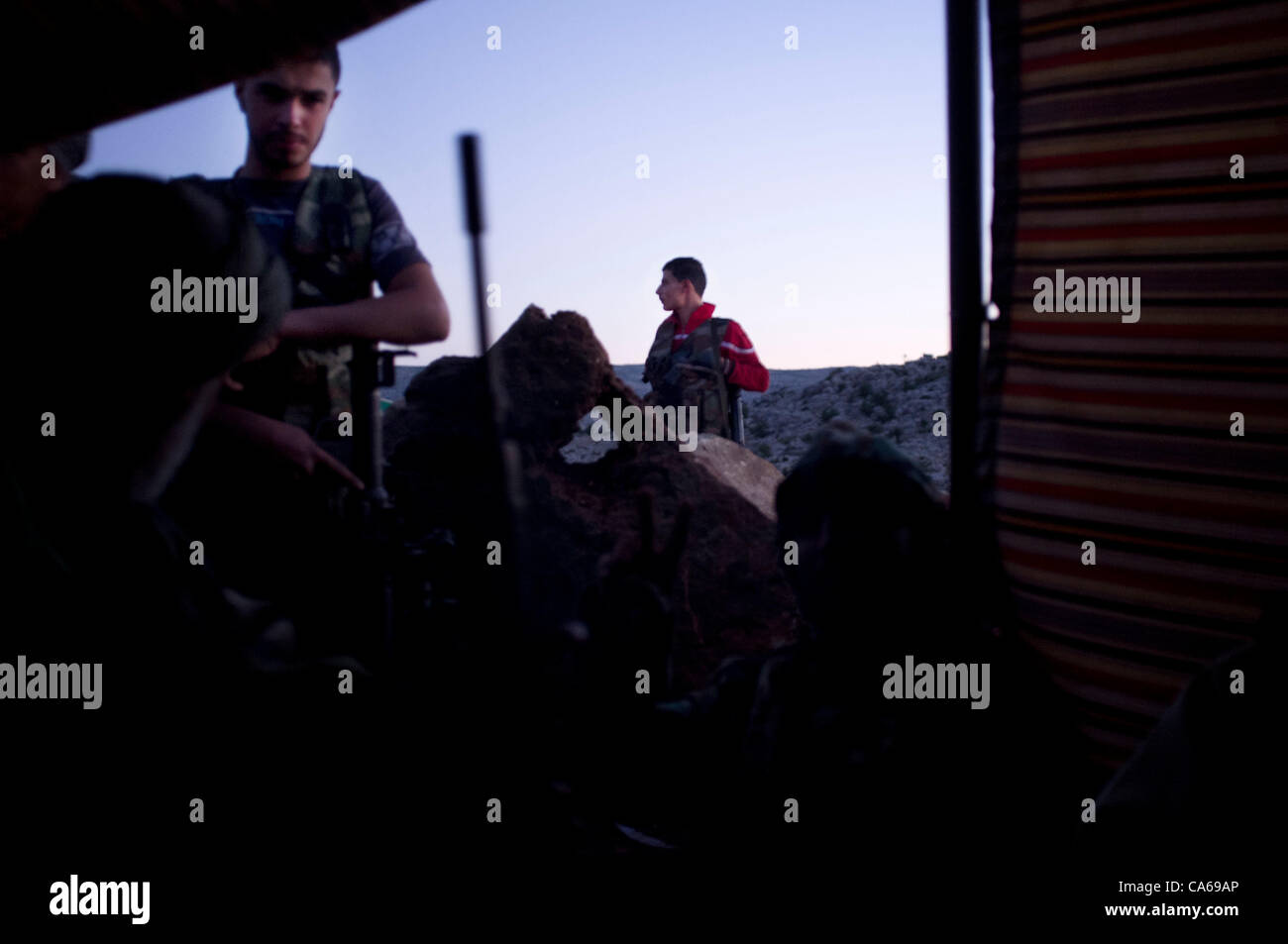 Young, FSA members man a checkpoint in the hills above Idlib.  The mountainous northern region along the border of Syria and Turkey remains a lifeline for the Free Syrian Army as weapons and supplies continue to pour across. The Syrian regime continues to amass armour and artillery in the lowlands,  Stock Photo