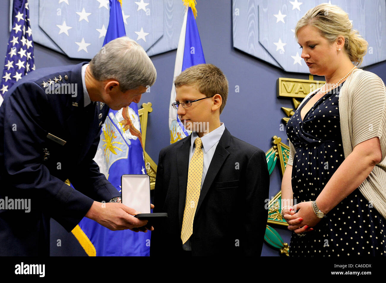 Trey Powers and Lindsey Barry, grandchildren of U2 pilot Capt. Francis Gary Powers are awarded the Silver Star posthumously by Air Force Chief of Staff General Norton Schwartz June 15, 2012 in the Pentagon.  Capt. Powers was shot down over the Soviet Union on May 1, 1960 while flying a classified U- Stock Photo