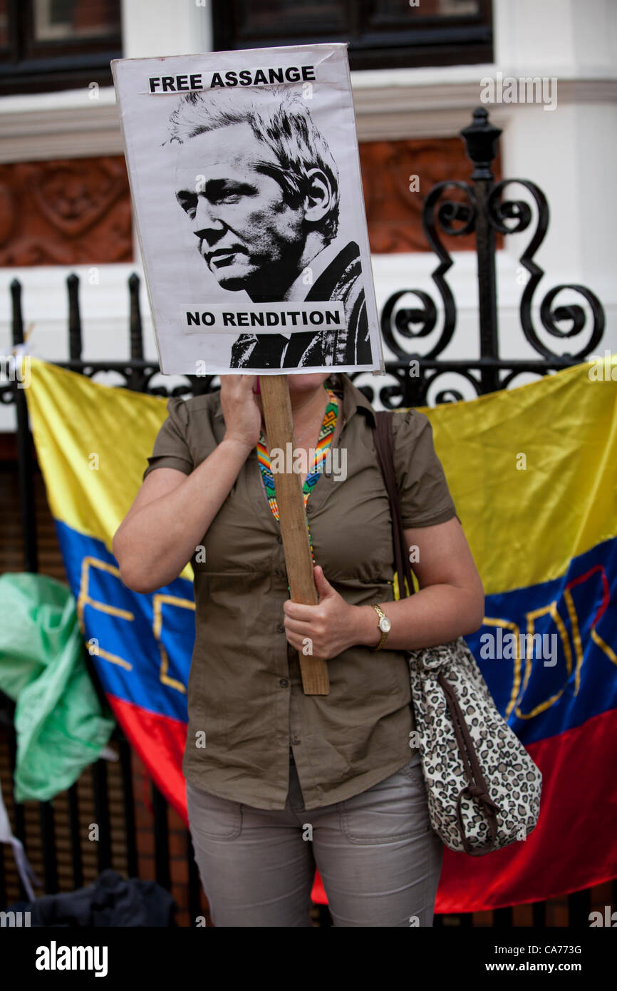 London, UK. 20th June, 2012. A protestor holds up a placard outside the Ecuadorian Embassy whilst the Wikileaks founder Julian Assange seeks asylum inside the Embassy. Stock Photo