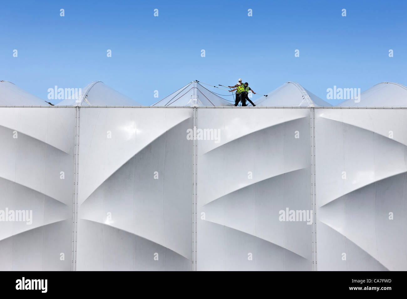 Workers giving a final clean to the roof of the Basketball Arena prior to the London 2012 Olympic Games Stock Photo