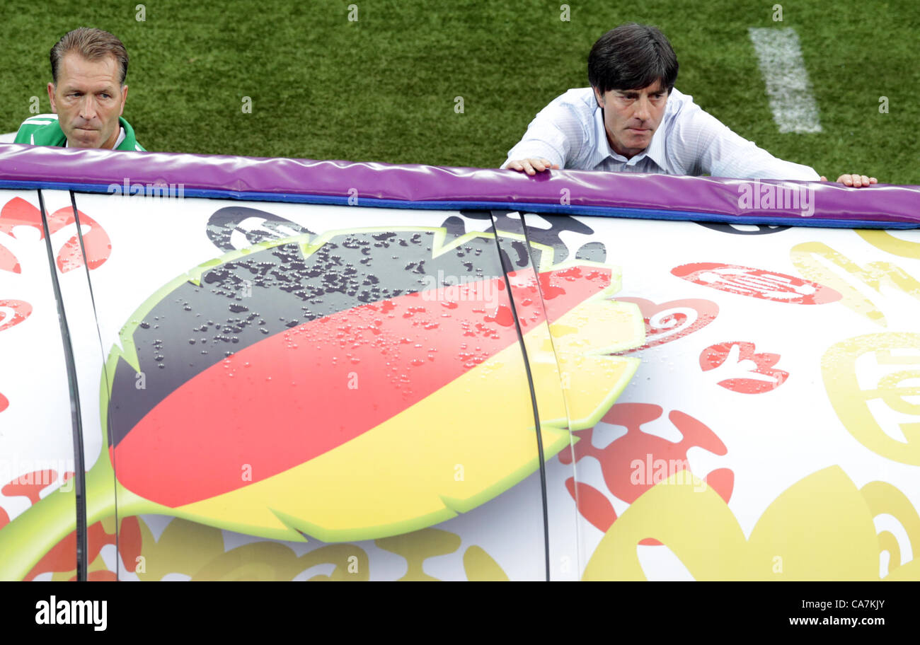 22.06.2012. Gdansk, Poland.  Germany's head coach Joachim Loew (R) and goalkeeper coach Andreas Koepke look into the stande near the sideline prior to UEFA EURO 2012 quarter- final soccer match Germany vs Greece at Arena Gdansk in Gdansk, Poland, 22 June 2012. Stock Photo