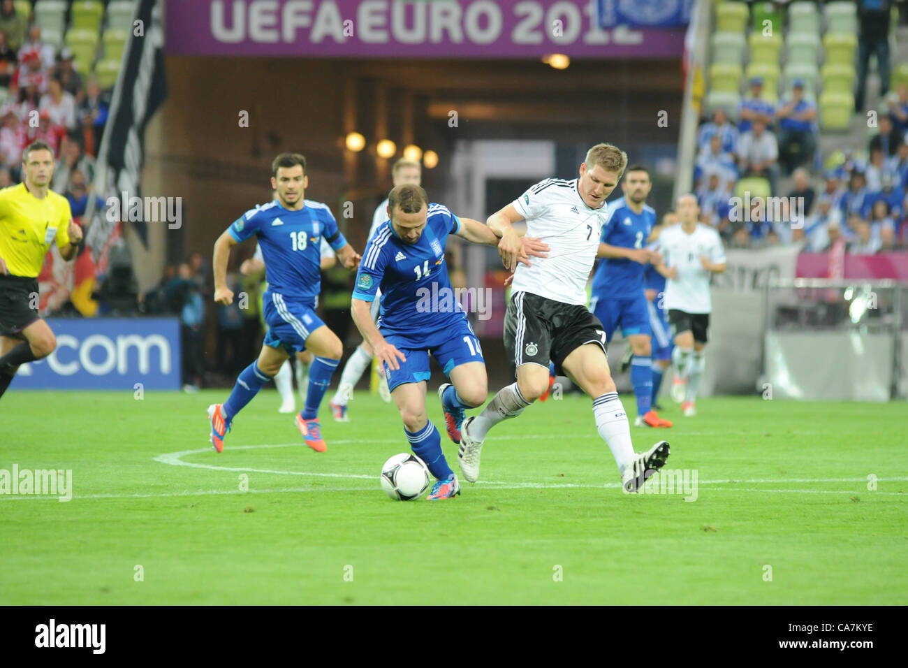 22.06.2012 , Gdansk, Poland. Dimitris Salpingidis (PAOK FC) Greece under pressure from Schwienstieger (Ger) during the European Championship Quarter Final game between Greece v Germany from the Gdansk Stadium. Stock Photo
