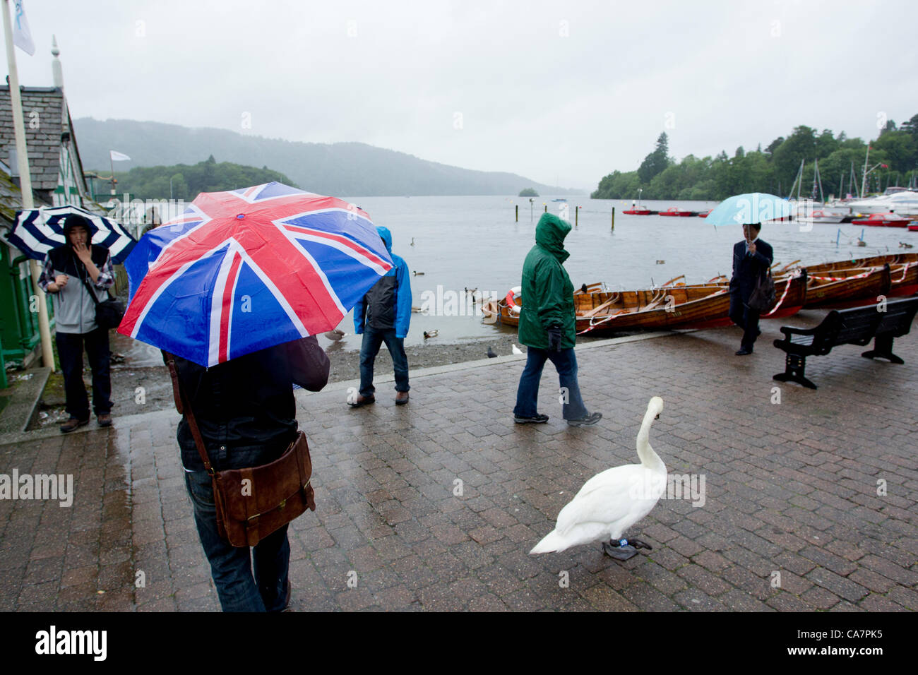 Saturday 23rd June 2012. Windermere, Cumbria, UK. Union Jack umbrella on Bowness Bay front in the rainy English weather. Stock Photo