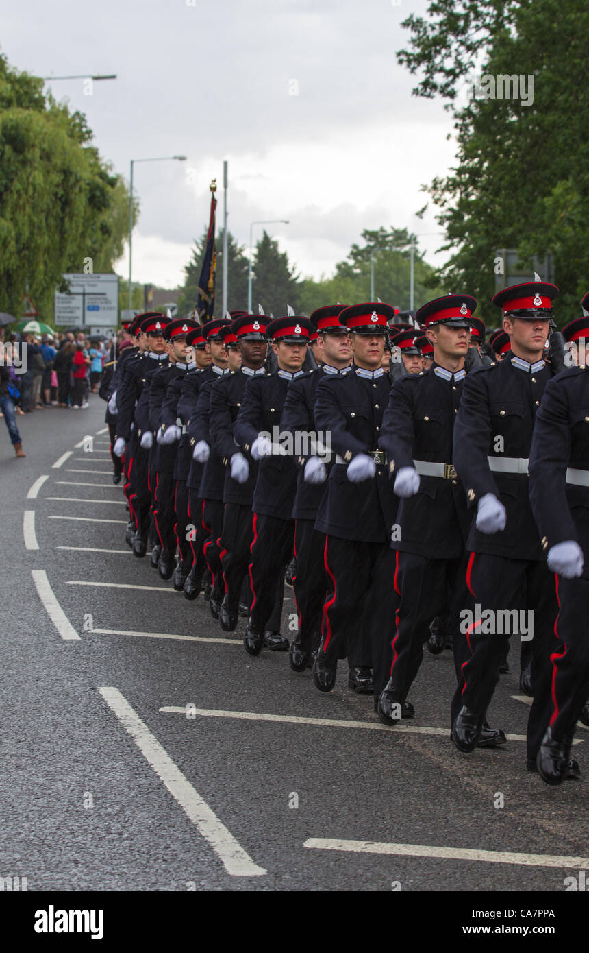 Sandhurst, UK. Saturday 23rd June 2012. Preceded by the Band of the Royal Logistics Corp, Officers & Officer Cadets of the Royal Military Academy (RMAS) march in rain through the streets of Sandhurst in a Freedom March celebrating the Academy's 200th anniversary Stock Photo
