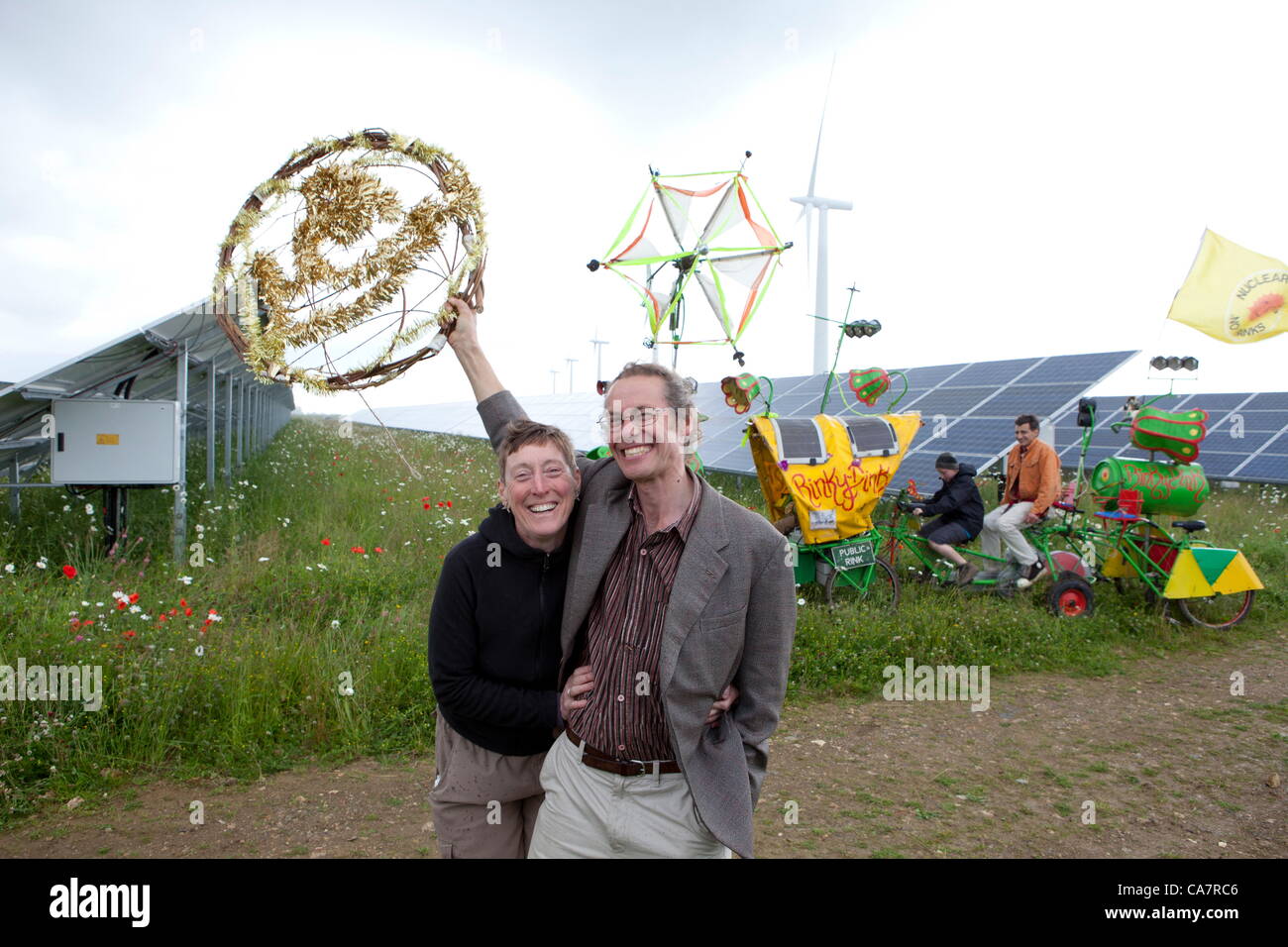 Westmill. Watchfield nr Swindon, UK. Saturday 23rd June 2012. Westmill energy farm on the day of its share offer on its solar farm. Pictured: Adam and Liz Twine. Adam is the owner of the farm and a Director of Westmill energy farm, Westmill is the first wind and solar park to be cooperatively owned by its members. The installed Solar panels will generate 4.8 GWh per year of clean electricity, enough to power 1,400 homes. Stock Photo