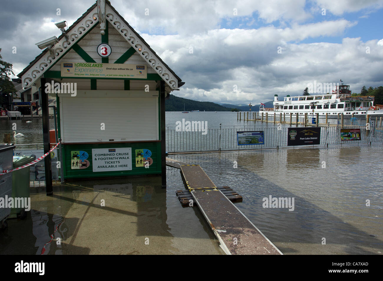 24th June Sunday 2012   Bowness Bay Cumbria  UK This is Lake Windermere at it's highest level this year. Closing pier three With the steaner the Swan in the backgound Credit Line : Credit:  Shoosmith Collection / Alamy Live News Stock Photo