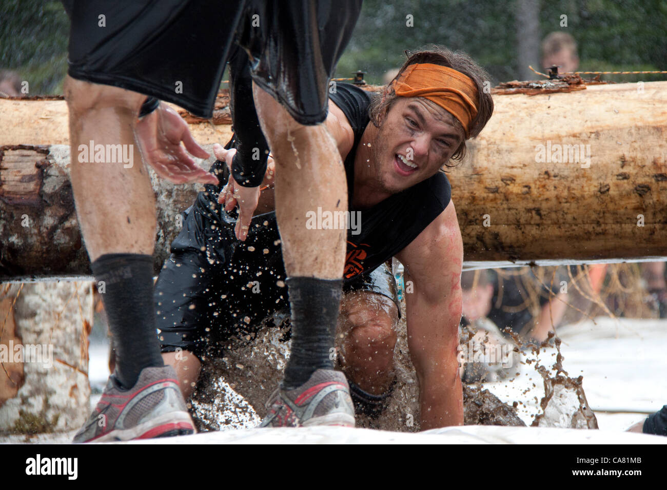June 23, 2012. Participants compete in the Tough Mudder event, known as the premier obstacle course series in the world, at the Whistler Olympic Park, Whistler, Canada Stock Photo