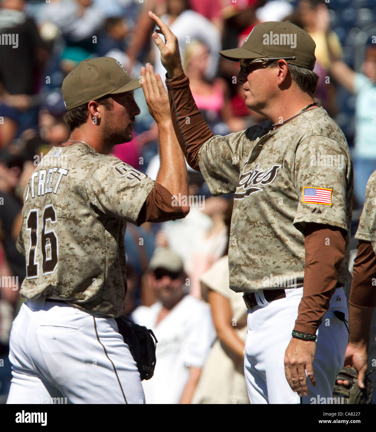 June 24, 2012 Padres pitching coach Darren Balsley, right, high fives