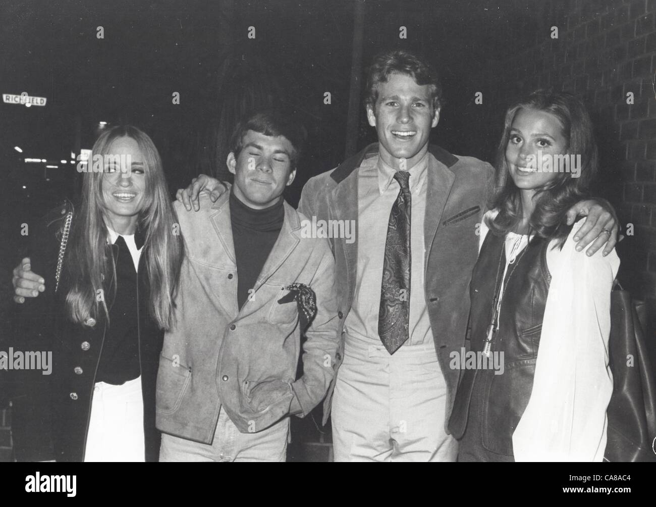 RYAN O'NEAL with wife and his brother Kevin O'Neal with date.(Credit