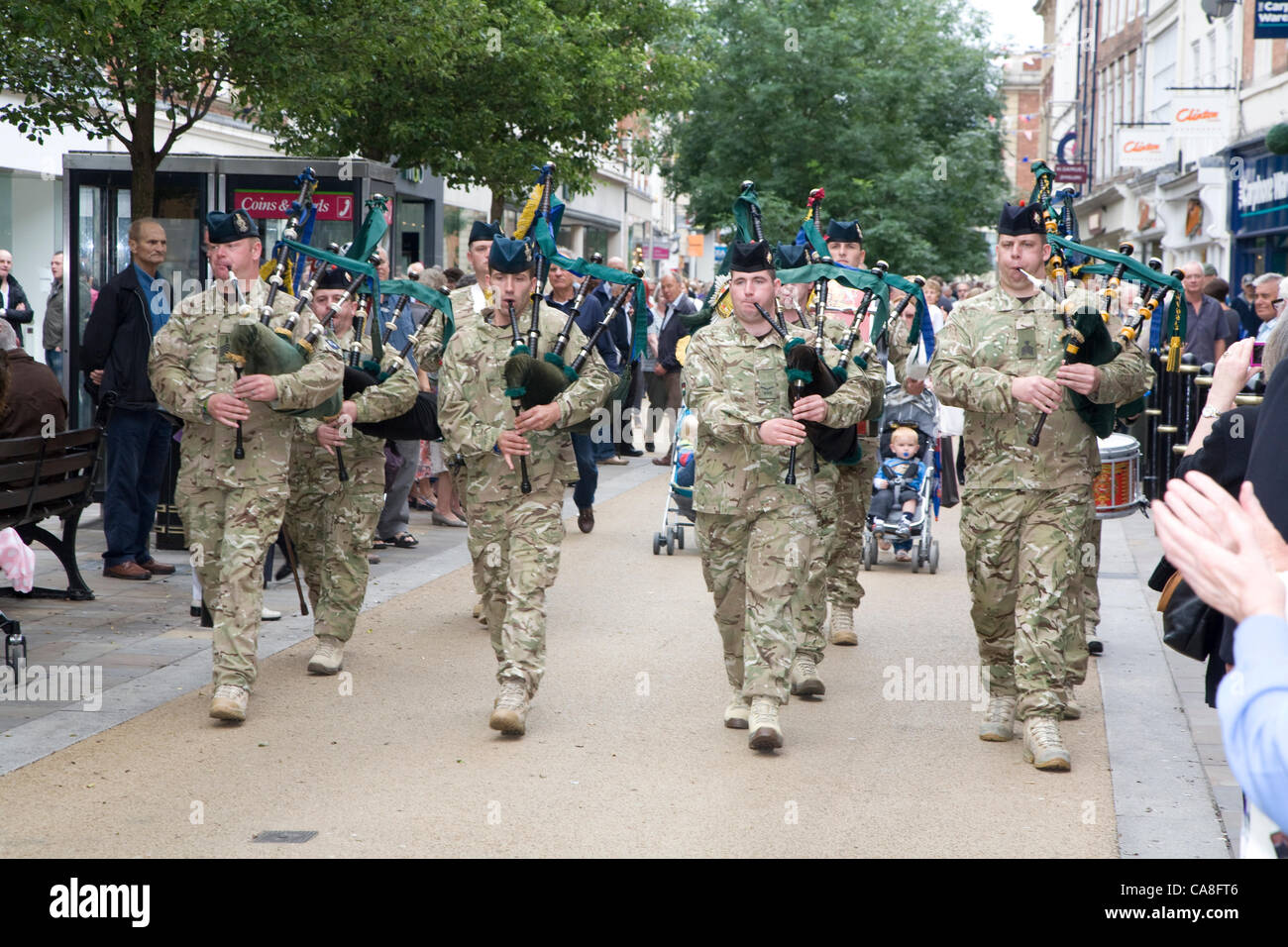 Worcester, England, UK. Wednesday 27th June 2012.  Soldiers from 2nd Battalion Mercian Regiment, Grenadier Guards, Queen's Royal Hussars and members of the Royal British legion, parade through the streets of Worcester. Seven soldiers from the city were also given their service medals. Stock Photo