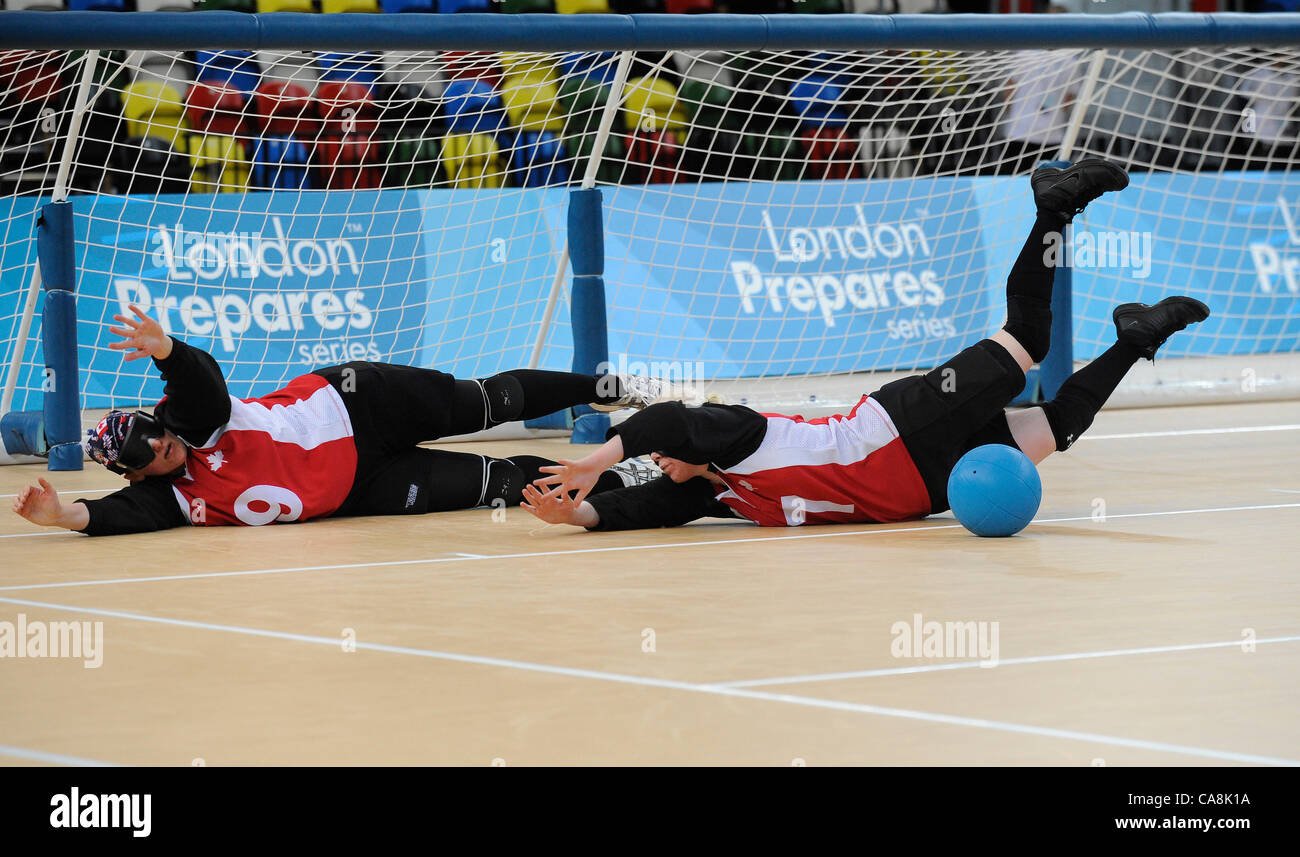 Amy KNEEBONE (CAN) backed up by Nancy MORIN (CAN) during Canada v USA, The London Prepares Goalball Paralympic Test Event - Poland  v China, Handball Arena, Olympic Park,  London, England December 3, 2011. Canada went on to win 5 - 1  Handball is played by blind or partially sighted athletes wearing Stock Photo