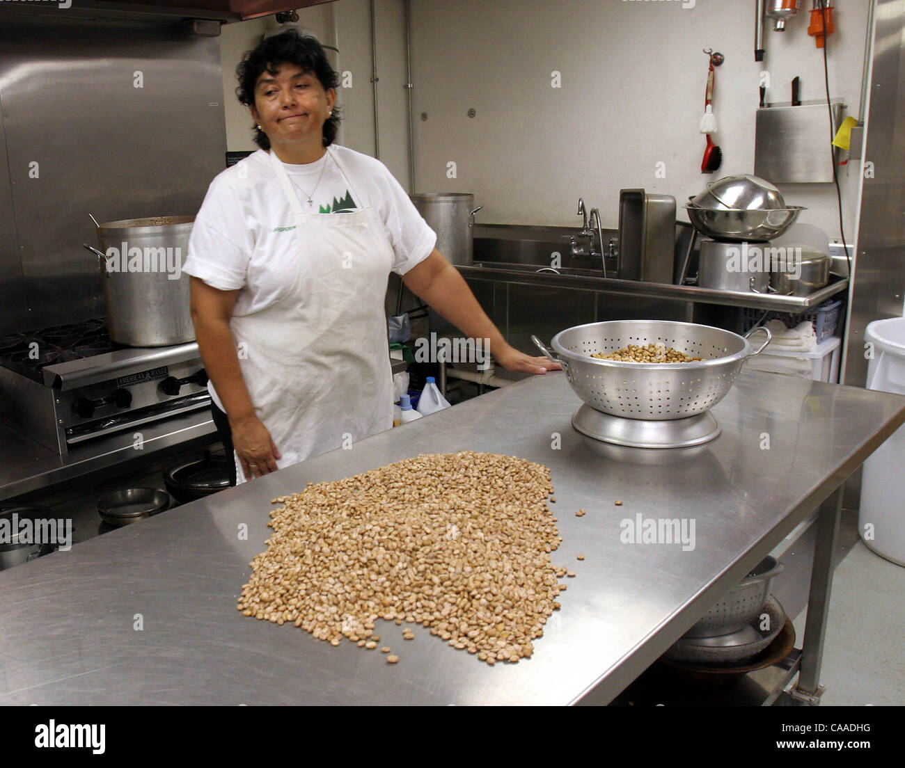 Whispering Winds Catholic Conference Center cook Roasaura Soto has cooked for days food to accomodate 1000 catholics expected at the center Sunday.   Her she tends to beans yet to be cooked.  UT/John Gastaldo Stock Photo