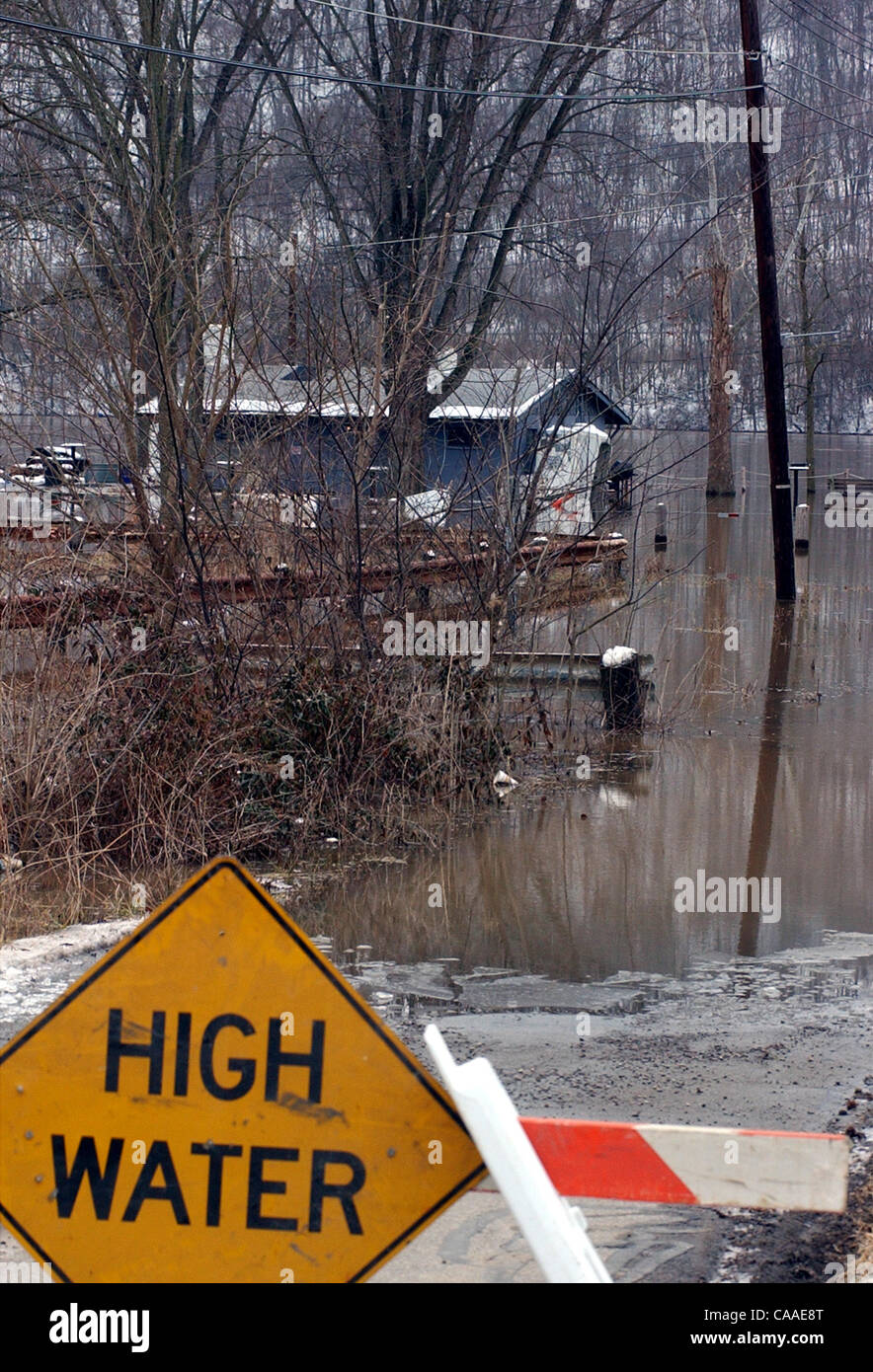 Feb 26, 2003 - Cincinnati, Ohio, USA - The rising waters of the Ohio River continue to swell to a flood stage of 52 feet, 26 feet over normal levels. Rising to a 6 year high, the water has covered the parking lots of restaurants, riverfront homes, flooded boat harbors, covered some low laying roads, Stock Photo