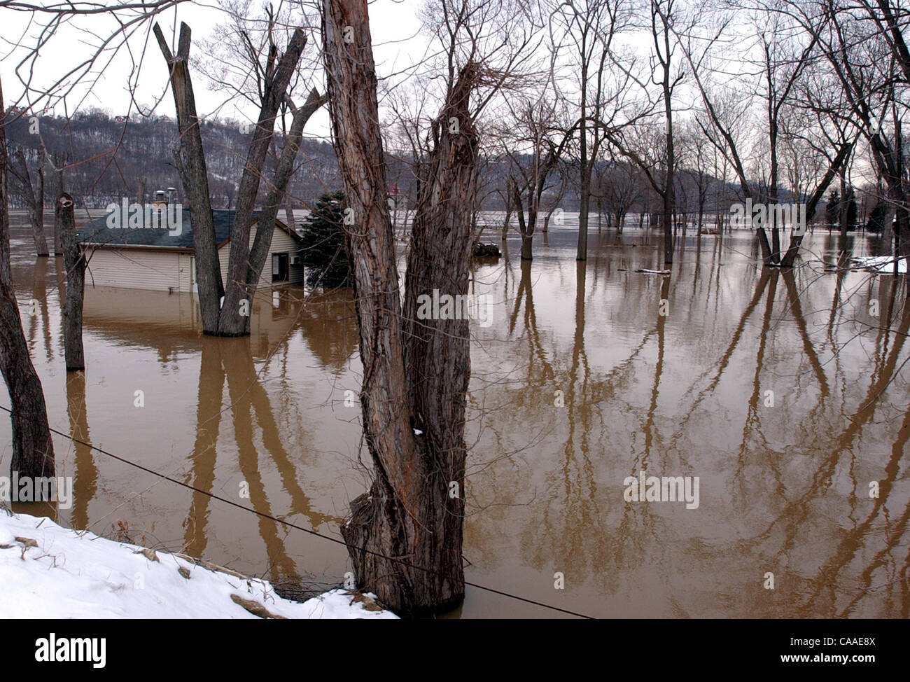 Feb 26, 2003 - Cincinnati, Ohio, USA - The rising waters of the Ohio River continue to swell to a flood stage of 52 feet, 26 feet over normal levels. Rising to a 6 year high, the water has covered the parking lots of restaurants, riverfront homes, flooded boat harbors, covered some low laying roads, Stock Photo