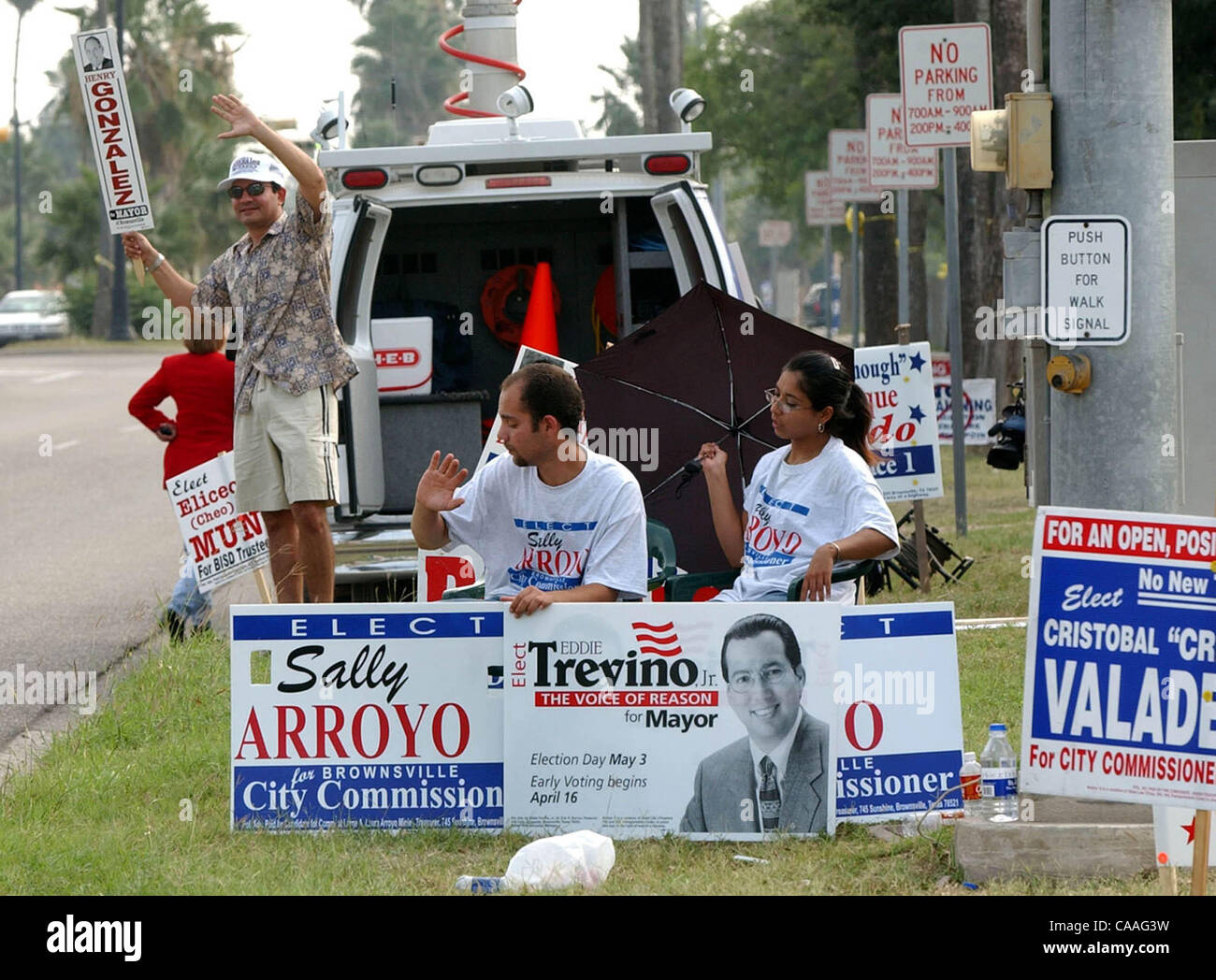 STATE/DAILY/ BROWNSVILLE ELECTIONS: Peter Ruiz, Ovidio Cisneros and Yadira Hernandez campaign for their own candidate at Sharp Elementary in Brownsville, Texas May 3, 2003. DELCIA LOPEZ/STAFF Stock Photo