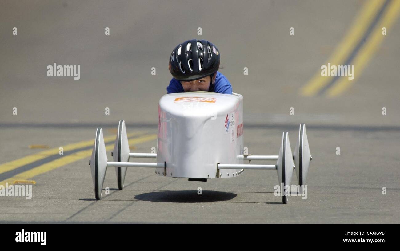 (Published 6/27/2004:1,2,3; UTS1816214) Joanna Munoz tries to squeeze out every bit of speed in her racer as she speeds down 25th Street in Sherman Heights during the All-American Soap Box Derby.  Earnie Grafton/UT Stock Photo