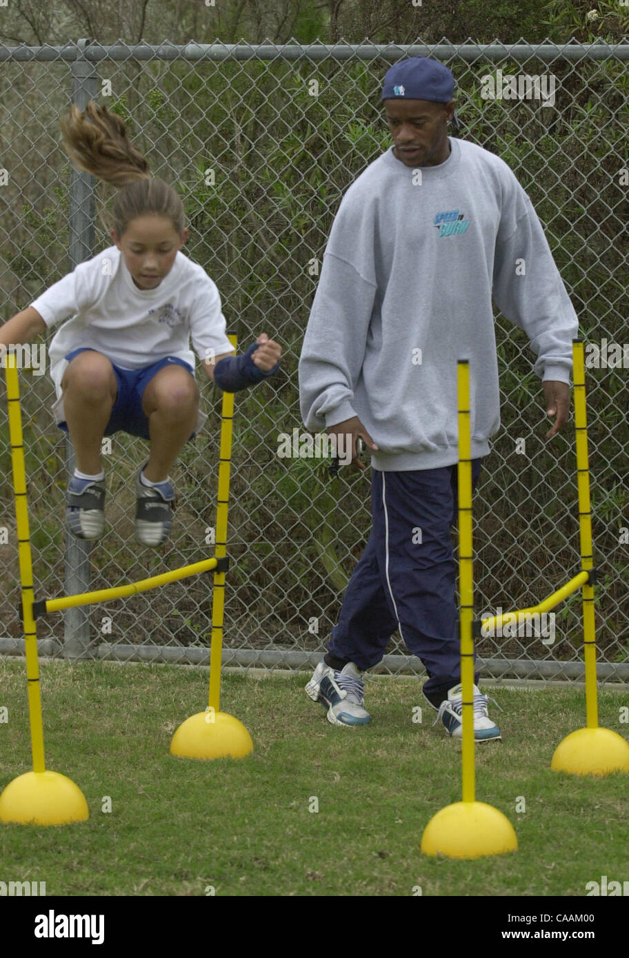 (Published 10/30/2003, NC-6; UTS1769097) Soccer player AERIEL HERNANDEZ (cq) runs through a conditioning course supervised by PAUL WRIGHT. This is a private session he's having with Aeriel and another player.  U/T photo CHARLIE NEUMAN Stock Photo