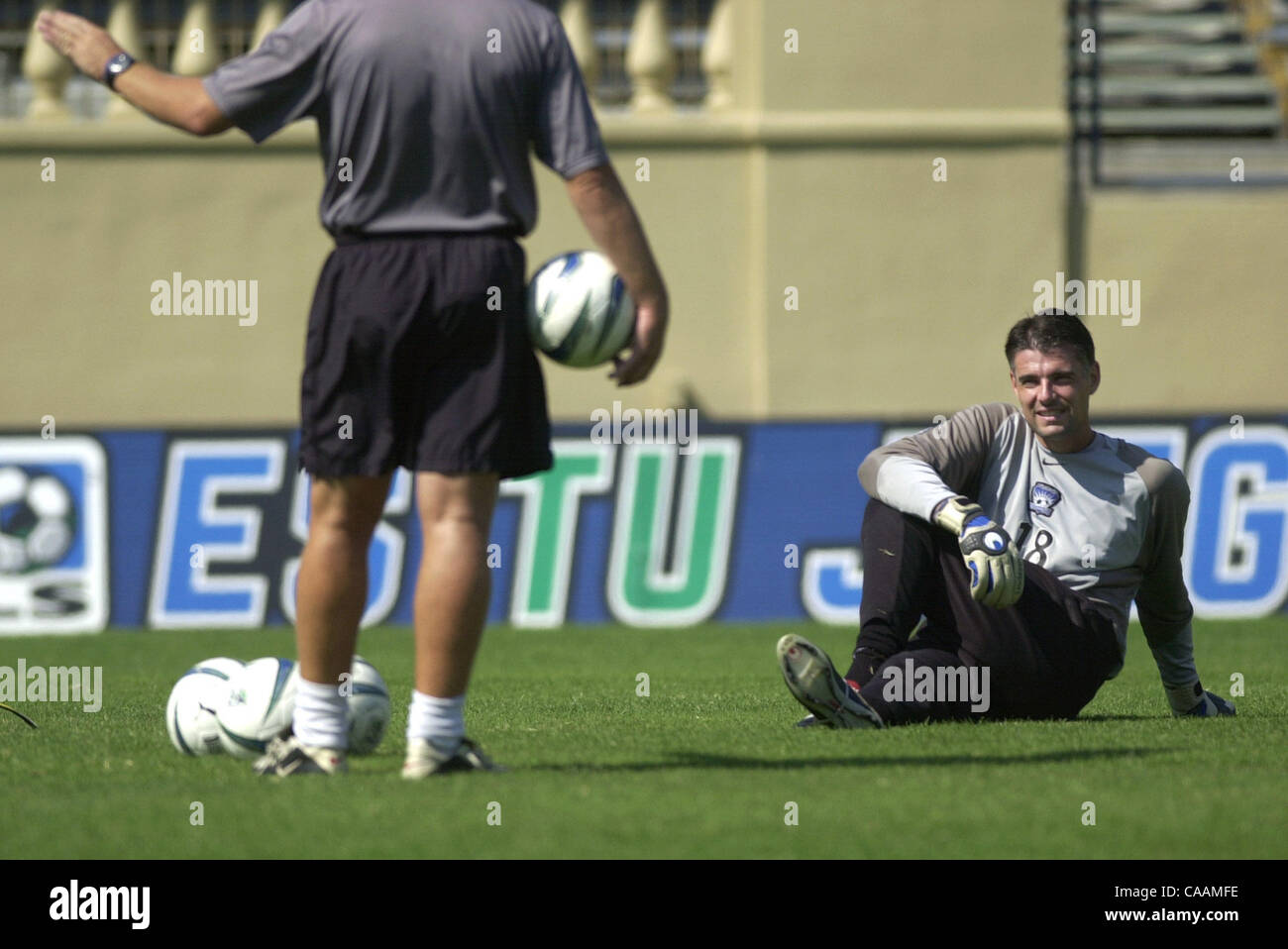 San Jose Earthquakes goalie Pat Onstad, right, stretches and listens to