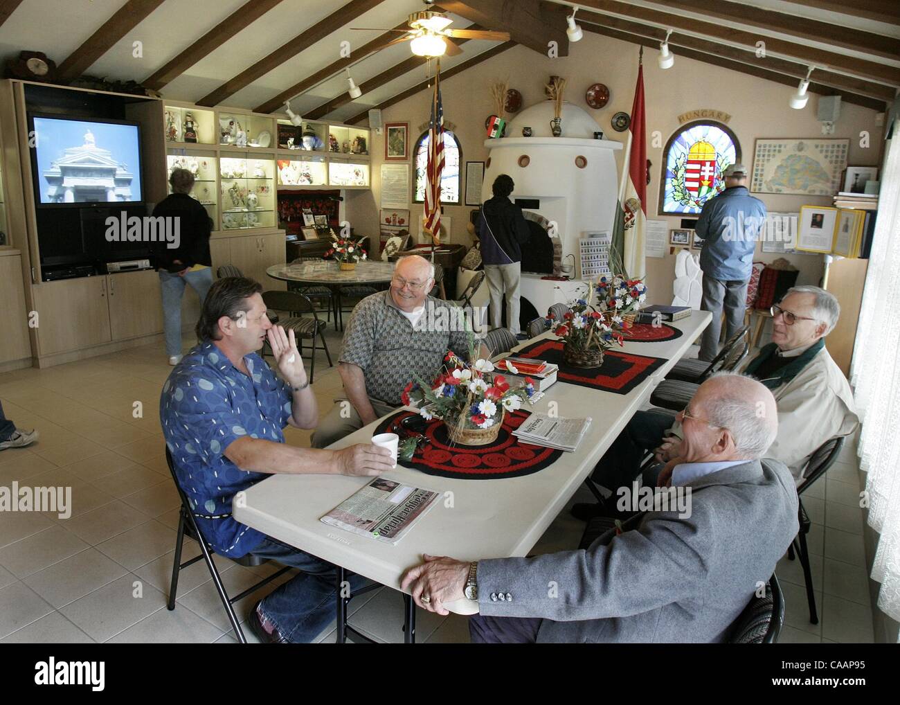 (Published 2/22/2005, B3) SLcottages235573x004/Feb 20Seated at end of table at left rear is