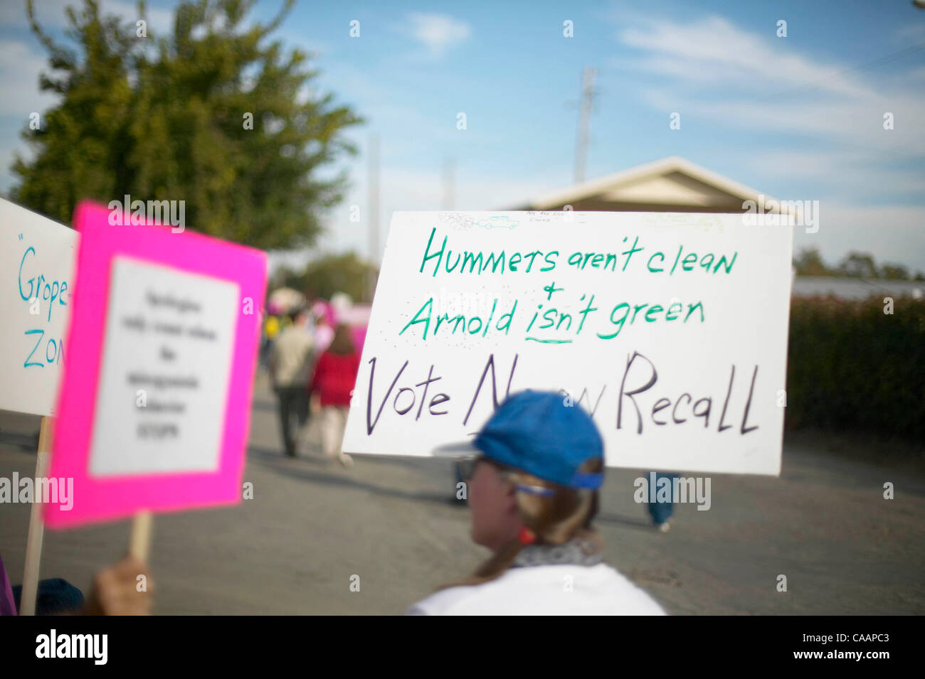 Jan 12, 2004; Oakland, CA, USA; At Arnold Schwarznenegger's Rally for Governor, picketers protest holding signes that read Hummers aren't clean and Arnold isn't green, Vote Now Recall. Stock Photo