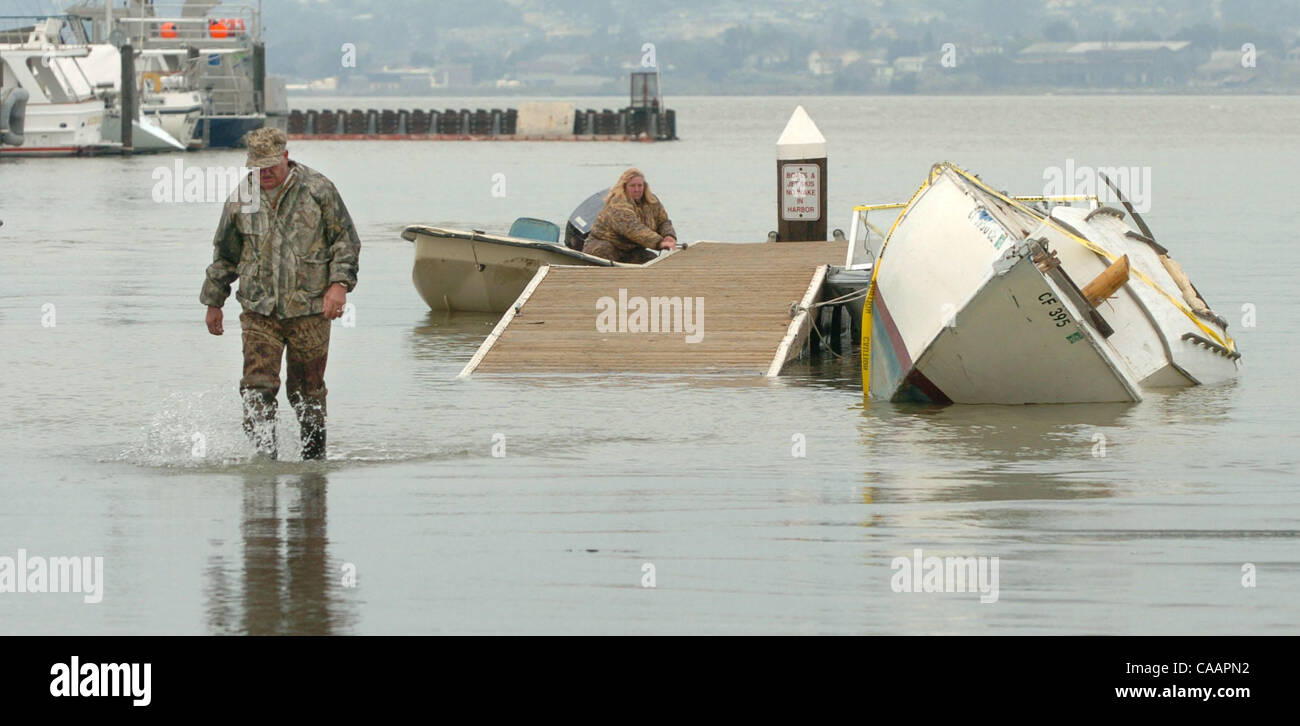 Vince Romeo Vince Romeo wades back for his truck through water from a high tide at ...